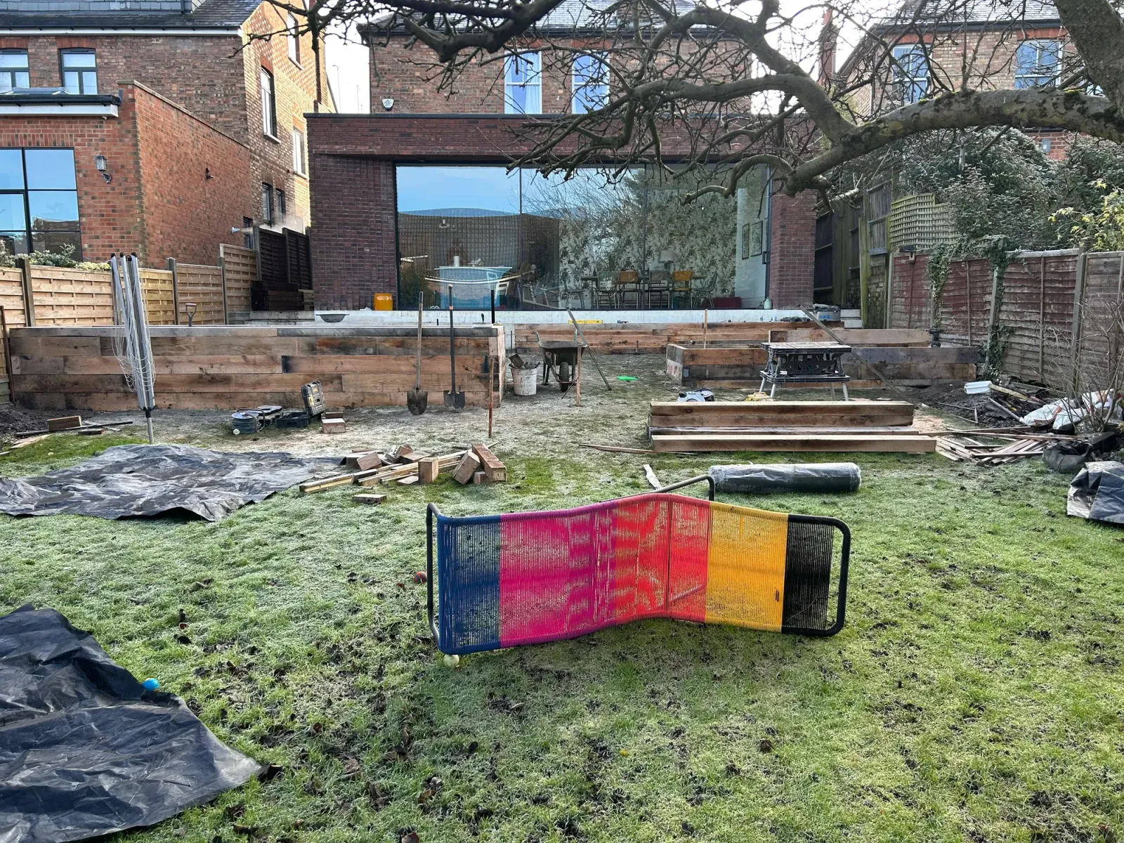 Finished raised flower beds wrapped around composite decking